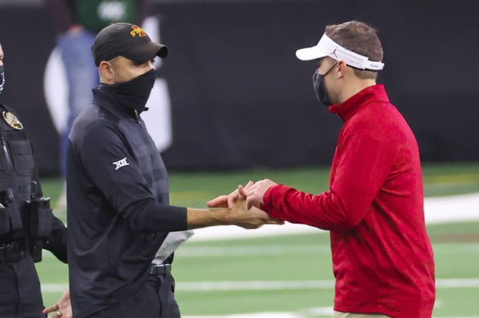 Oklahoma coach Lincoln Riley with Iowa State coach Matt Campbell